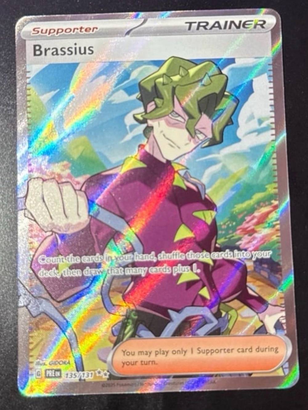 Brassius Trainer 135/131 SV: Prismatic Evolutions Ultra Rare HoloFoil DAMAGE